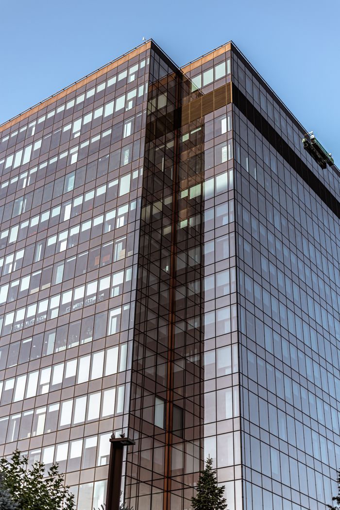 hero-img-01 High-rise glass office building in Timișoara, Romania, captured in daylight.